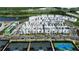 Aerial view of community homes with modern architectural design and community tennis courts in the foreground at 2225 Valentine Aly, Orlando, FL 32804