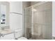 Modern bathroom with glass enclosed shower, gray tile, and vanity sink at 2225 Valentine Aly, Orlando, FL 32804