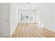 Bright dining room with three large windows, hardwood floors, and a modern chandelier at 2225 Valentine Aly, Orlando, FL 32804
