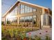 Modern building surrounded by flowers with expansive windows to bring in lots of natural light at 2225 Valentine Aly, Orlando, FL 32804