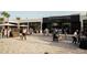 Exterior view of the Great Southern Box Company Food Hall bustling with people and activity at 2225 Valentine Aly, Orlando, FL 32804