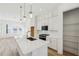 Bright open kitchen with a large center island, stainless appliances, and pantry at 2225 Valentine Aly, Orlando, FL 32804