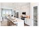 Modern kitchen featuring a large island, stainless steel appliances, and open access to the living space at 2225 Valentine Aly, Orlando, FL 32804