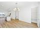 Bright living space with wood flooring, a closet, and views into the kitchen at 2225 Valentine Aly, Orlando, FL 32804