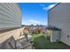 Outdoor rooftop area featuring a built-in grill, dining table, seating, and an artificial turf area at 2225 Valentine Aly, Orlando, FL 32804