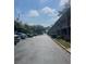 Apartment buildings with ample parking, landscaping, and lake view at 2500 Lee Rd # 202, Winter Park, FL 32789