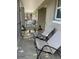 Relaxing outdoor balcony featuring patio furniture, plants, and peaceful community views at 2500 Lee Rd # 202, Winter Park, FL 32789