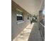 Outdoor walkway featuring railings, natural light and views of the surrounding landscape at 2500 Lee Rd # 202, Winter Park, FL 32789