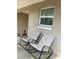 Outdoor balcony featuring rocking chairs, plants, and ample sunlight at 2500 Lee Rd # 202, Winter Park, FL 32789