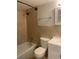Full bathroom featuring tile walls, shower, toilet and vanity at 2500 Lee Rd # 202, Winter Park, FL 32789
