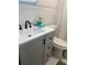 Bright bathroom with white vanity and subway tile backsplash at 2500 Lee Rd # 202, Winter Park, FL 32789
