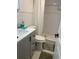 Bathroom featuring gray vanity, commode, and shower with white subway tile at 2500 Lee Rd # 202, Winter Park, FL 32789