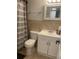 Bathroom with white vanity, mirror and grey shower curtain at 2500 Lee Rd # 202, Winter Park, FL 32789