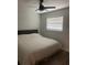 Bedroom with ceiling fan, new wood floors, and window with blinds at 2500 Lee Rd # 202, Winter Park, FL 32789