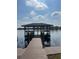 Lakeside community dock featuring a covered gazebo seating area and scenic water views at 2500 Lee Rd # 202, Winter Park, FL 32789