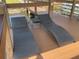 Comfortable chaise lounges on a wood-plank dock are situated near the water's edge, perfect for relaxation at 2500 Lee Rd # 202, Winter Park, FL 32789