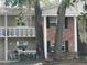 Condo exterior showcasing white railing and rocking chair on the front porch at 2500 Lee Rd # 202, Winter Park, FL 32789