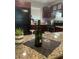 Kitchen featuring granite countertops, stainless appliances, and wine rack at 2500 Lee Rd # 202, Winter Park, FL 32789