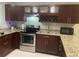 Modern kitchen featuring granite countertops, stainless appliances, and wine rack at 2500 Lee Rd # 202, Winter Park, FL 32789