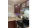 Close-up of kitchen countertop and cabinets, showcasing modern appliances and sleek countertops at 2500 Lee Rd # 202, Winter Park, FL 32789