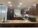 Modern kitchen featuring granite countertops, stainless appliances, and wine rack at 2500 Lee Rd # 202, Winter Park, FL 32789
