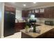 Stylish kitchen showcasing dark wood cabinetry and countertops, complete with modern appliances at 2500 Lee Rd # 202, Winter Park, FL 32789