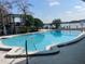 Community pool with lake views, perfect for relaxation and enjoying the Florida sunshine at 2500 Lee Rd # 202, Winter Park, FL 32789