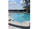 Community pool with serene lake views, offering a refreshing escape and relaxation at 2500 Lee Rd # 202, Winter Park, FL 32789
