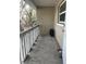 Outdoor porch area featuring a tire and white railing at 2500 Lee Rd # 202, Winter Park, FL 32789