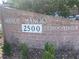 Lakeside Manor Condominium sign with brick surround and lush landscaping at 2500 Lee Rd # 202, Winter Park, FL 32789