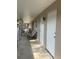 Exterior walkway with patio furniture leading to front door 202 at 2500 Lee Rd # 202, Winter Park, FL 32789