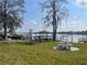 Beautiful waterfront lawn with seating areas and docks, offering a relaxing lakeside experience at 2500 Lee Rd # 202, Winter Park, FL 32789