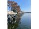 Picturesque waterfront view with private boat docks, offering serene lake access and scenic beauty at 2500 Lee Rd # 202, Winter Park, FL 32789