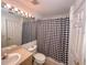 Bright bathroom with a shower curtain and a white vanity at 2609 Summer Creek Dr, Kissimmee, FL 34747
