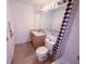 Bright bathroom with a shower curtain and a white vanity at 2609 Summer Creek Dr, Kissimmee, FL 34747