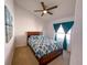 Bedroom featuring a wood bed frame, ceiling fan, and bright natural light at 2609 Summer Creek Dr, Kissimmee, FL 34747