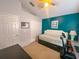 Bedroom with a teal accent wall, vaulted ceiling, and a double closet at 2609 Summer Creek Dr, Kissimmee, FL 34747