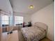 Cozy bedroom featuring an oversized dresser and a large window at 2609 Summer Creek Dr, Kissimmee, FL 34747