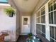 Charming entryway with a decorative wreath, seating, and plenty of natural light at 2609 Summer Creek Dr, Kissimmee, FL 34747