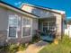 Welcoming front porch with decorative plants and a cozy seating area at 2609 Summer Creek Dr, Kissimmee, FL 34747