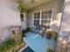 Inviting porch featuring plants and a bench, leading to the home's entrance at 2609 Summer Creek Dr, Kissimmee, FL 34747