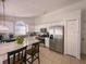 Modern kitchen with stainless steel appliances, a breakfast bar, and ample cabinet space at 2609 Summer Creek Dr, Kissimmee, FL 34747