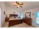 Spacious main bedroom with vaulted ceilings, an oversized dresser, and an abundance of natural light at 2609 Summer Creek Dr, Kissimmee, FL 34747