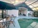 Backyard pool, patio with lounge furniture, and partially covered living space at 2609 Summer Creek Dr, Kissimmee, FL 34747