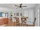 Cozy dining area featuring a ceiling fan, table set for four, and charming decor at 2783 Trommel Way, Sanford, FL 32771
