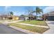 Well-maintained single Gathering home with a two car garage and a green lawn at 2783 Trommel Way, Sanford, FL 32771