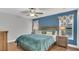 Tranquil main bedroom with a large bed, side tables, and natural light at 2783 Trommel Way, Sanford, FL 32771