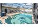 Inviting pool with a compass design, surrounded by lounge areas and screened enclosure at 2783 Trommel Way, Sanford, FL 32771