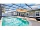 Enclosed pool area features comfortable seating and a compass inlay for added charm at 2783 Trommel Way, Sanford, FL 32771
