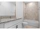 Clean bathroom featuring a bathtub and granite vanity at 2896 Lingo Ln, Orlando, FL 32822